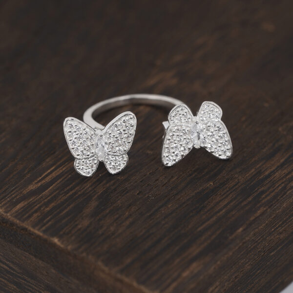 Two Butterfly Between the Finger ring